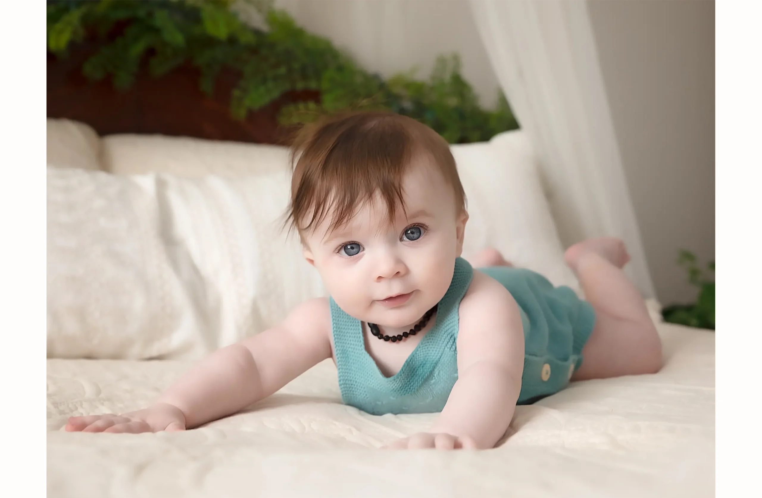 Infant laying on a bed