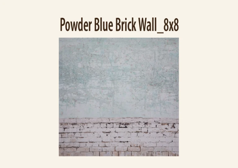 A weathered green and white textured backdrop over a white brick wall.