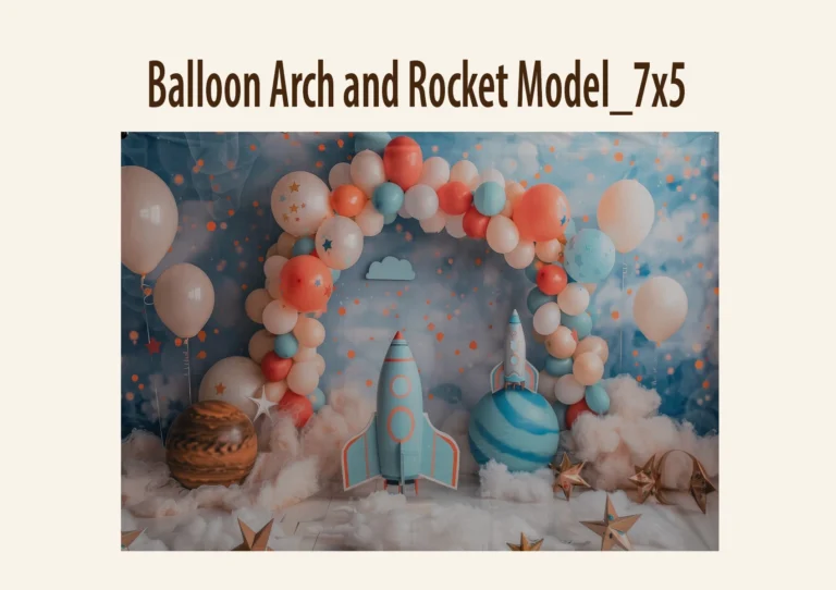 Space-themed photography backdrop with balloon arch, rockets, and star decorations.